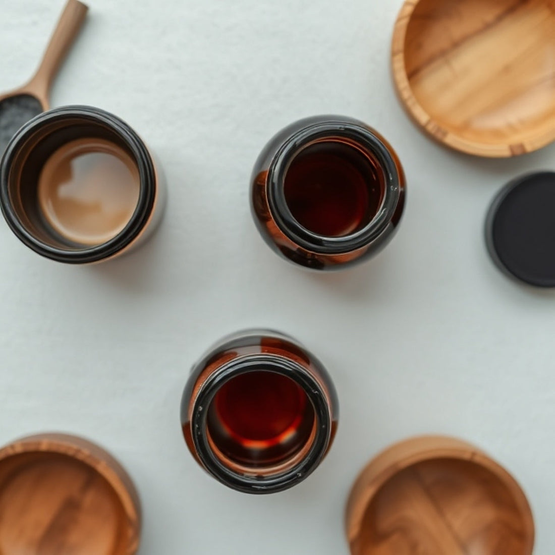 Gentle Roots eco-friendly skincare jars with bamboo lids – sustainable, reusable packaging for natural balms and oils.