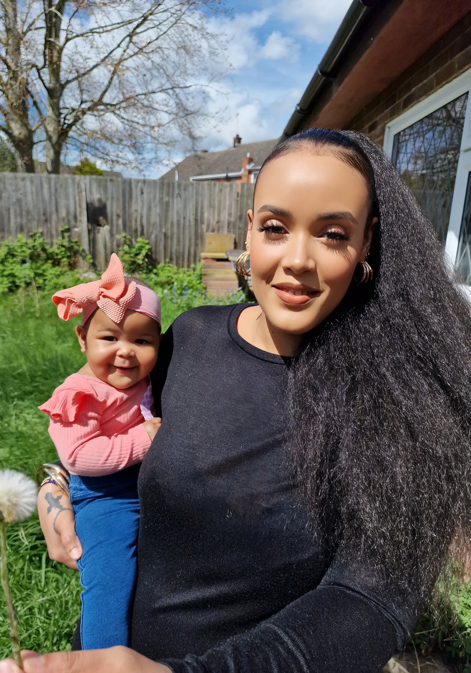Jessica, founder of Gentle Roots, holding her baby – the inspiration behind the handmade, non-toxic family skincare brand.