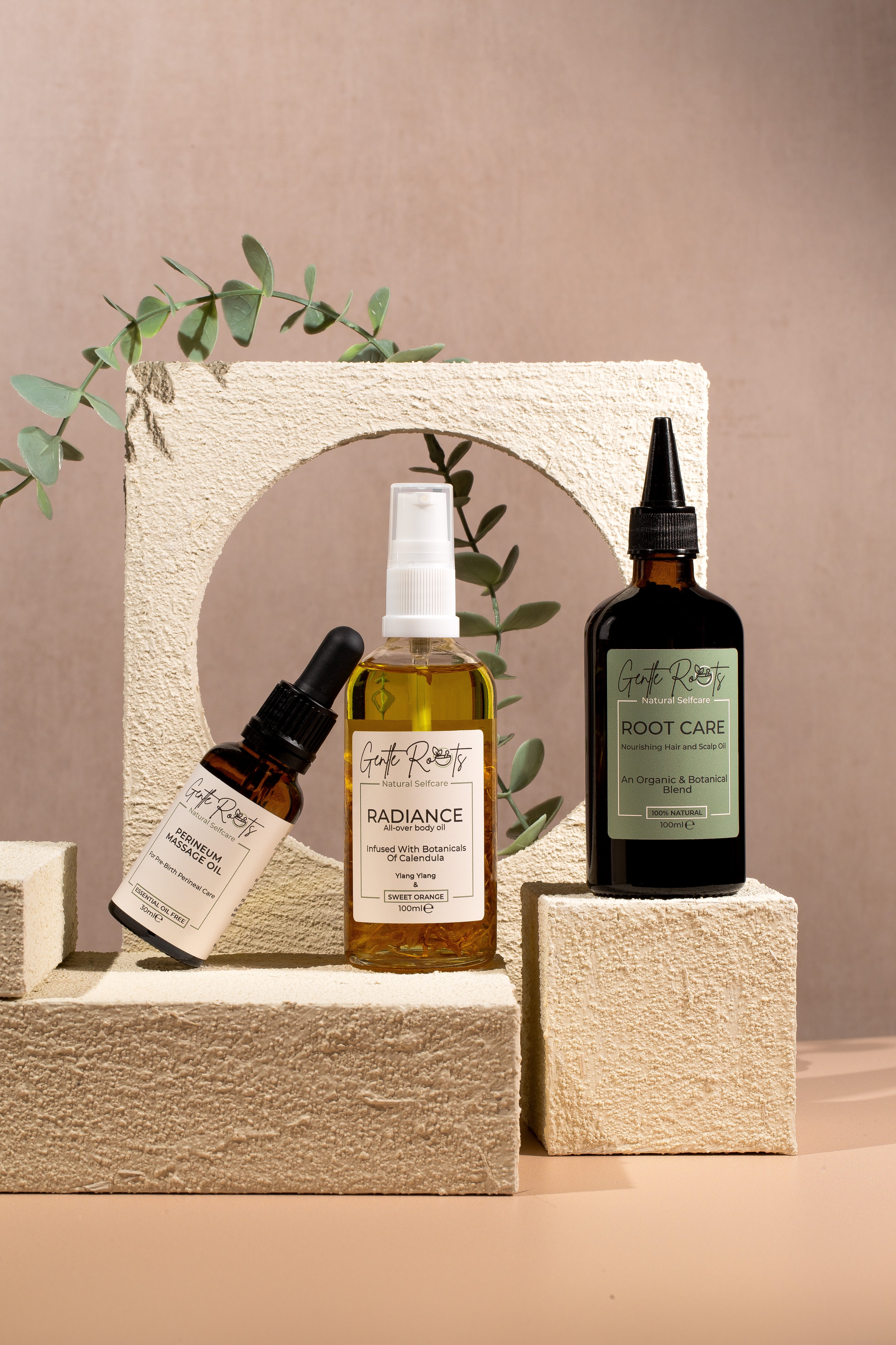 Set of skincare products on a stone shelf with a beige background