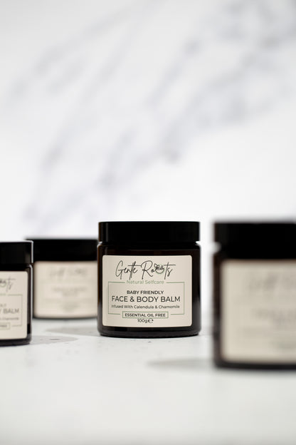Gentle Roots Baby Friendly Face and Body Balm jars displayed in group on white surface.