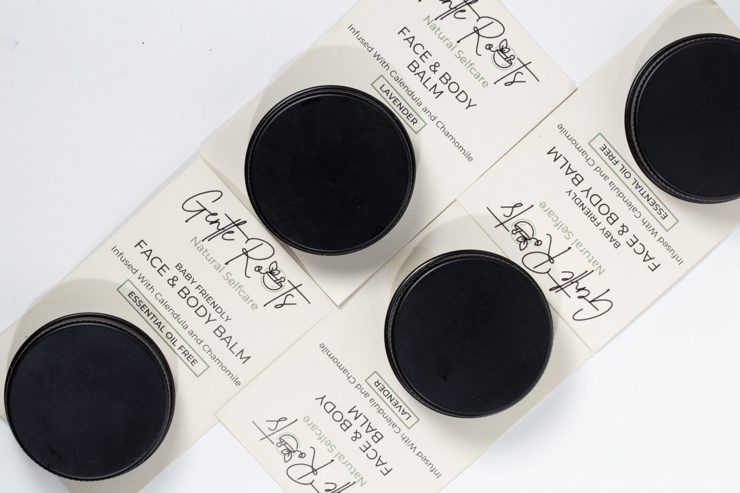 Gentle Roots Baby Friendly Face and Body Balm minis flatlay – natural travel-size skincare jars.