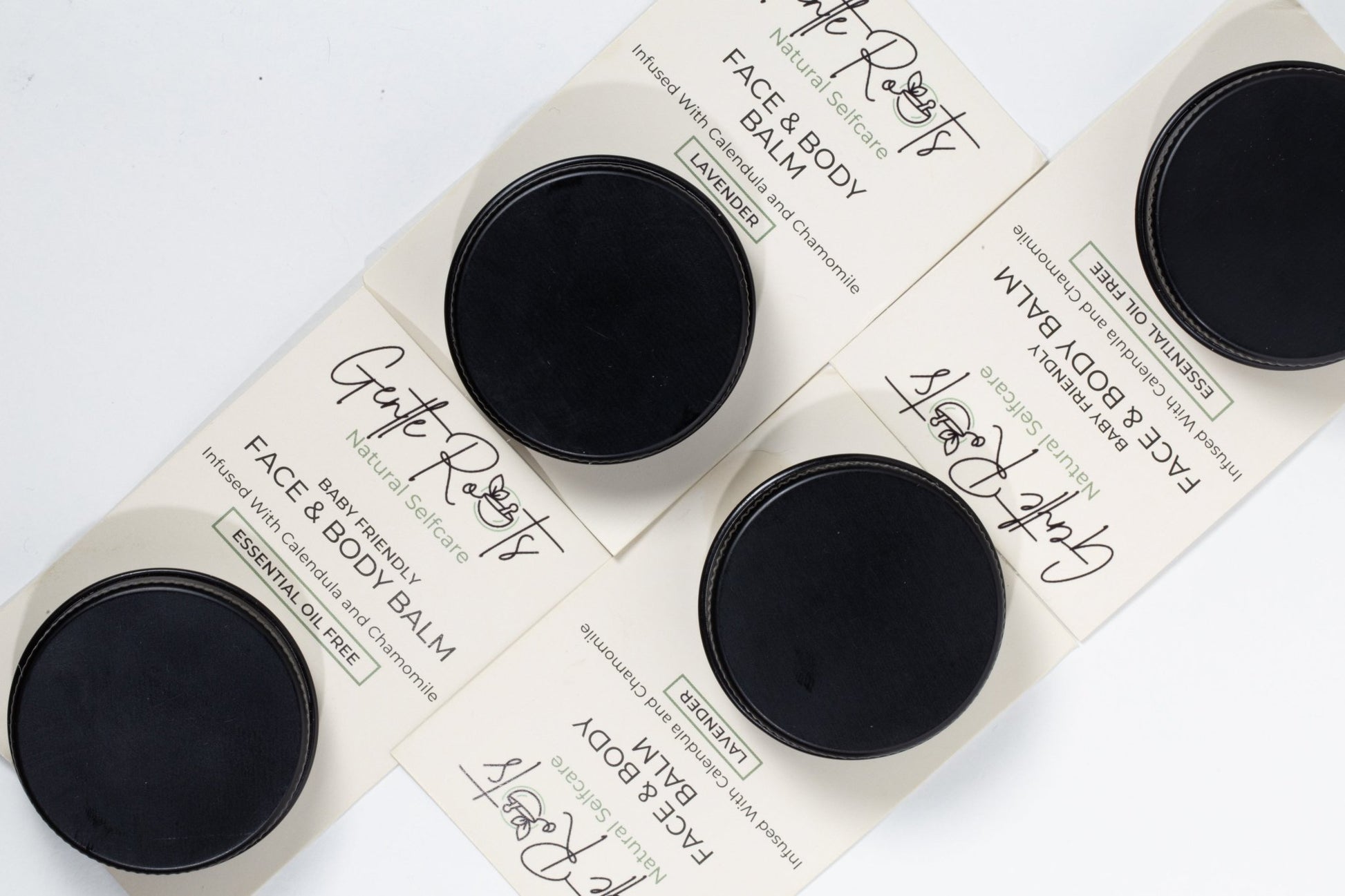 Gentle Roots Baby Friendly Face and Body Balm minis flatlay – natural travel-size skincare jars.