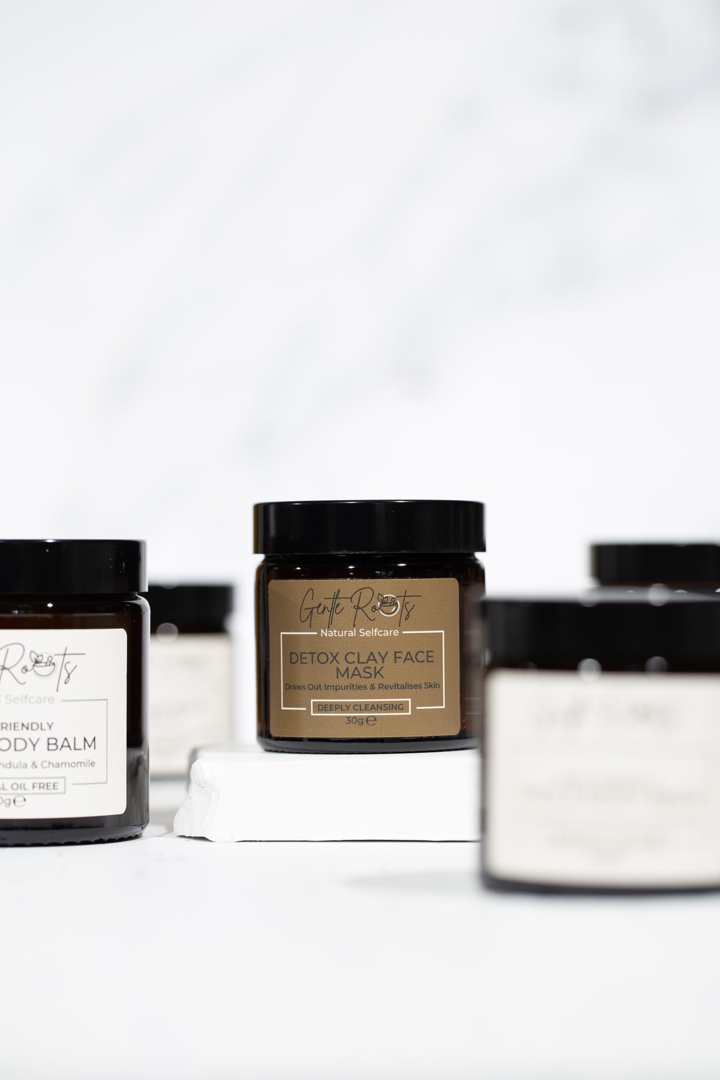Collection of Detox Clay Face Mask jars on clean white background – Gentle Roots