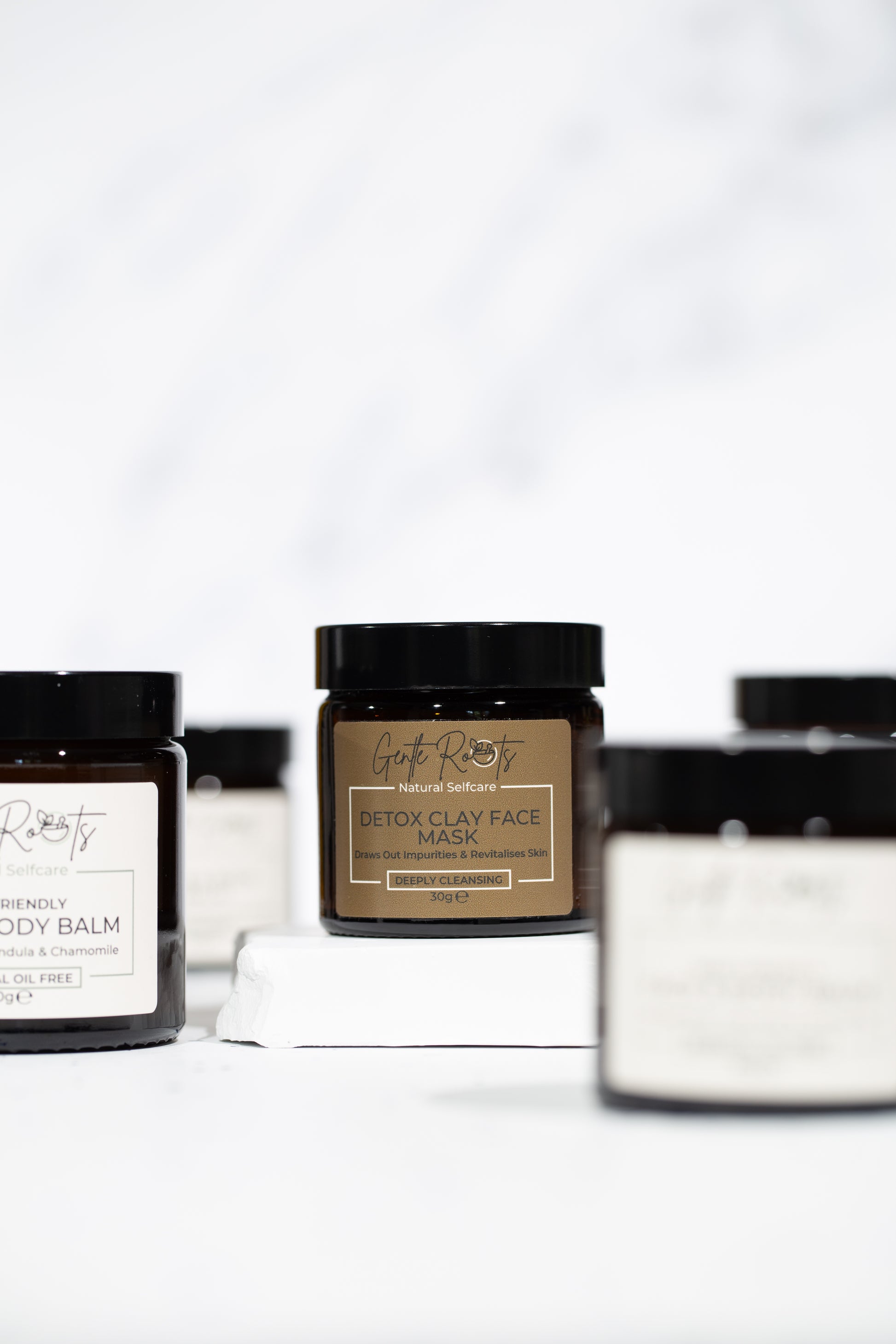 Collection of Detox Clay Face Mask jars on clean white background – Gentle Roots