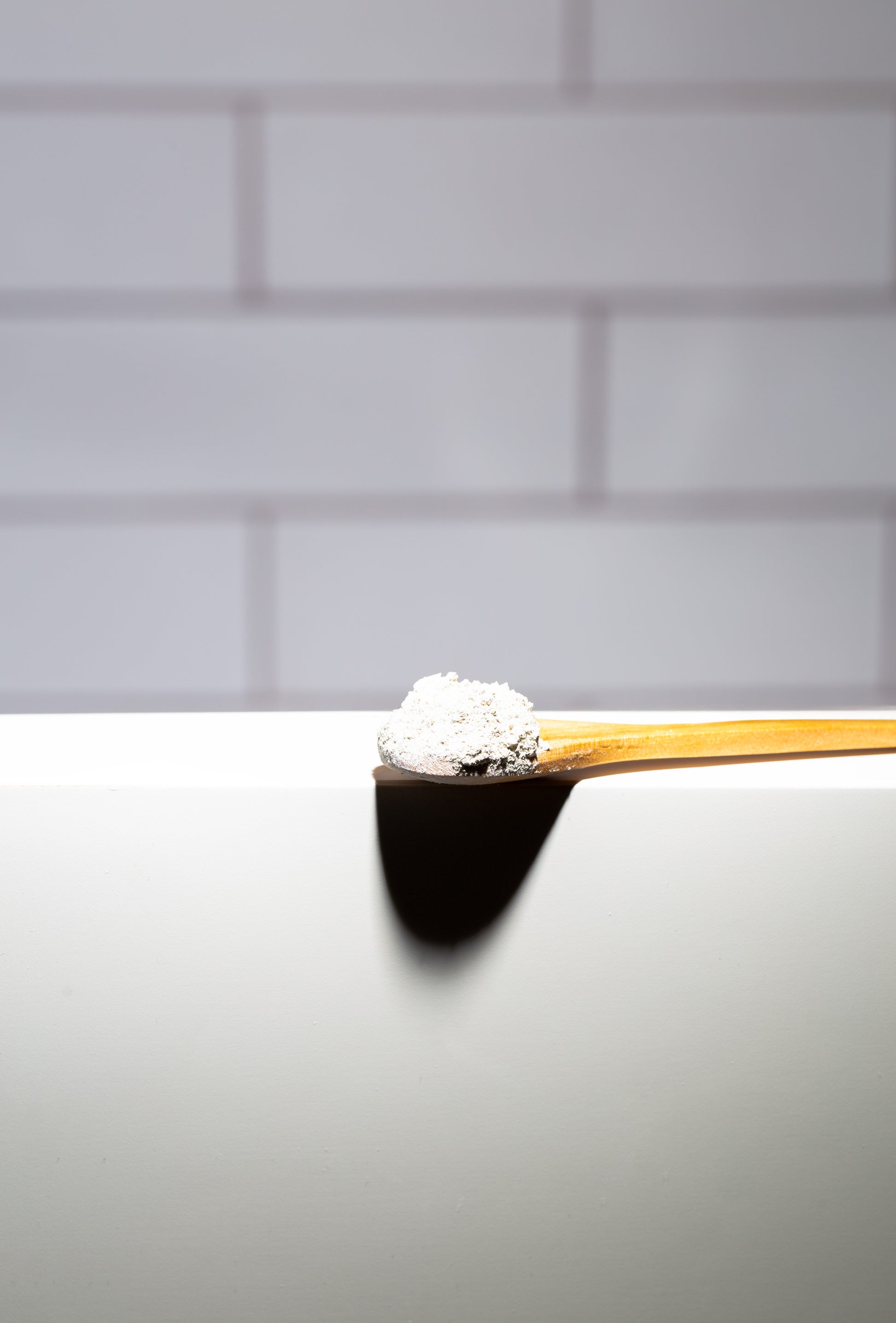 Bamboo spoon with powdered Detox Clay Face Mask – eco-friendly skincare