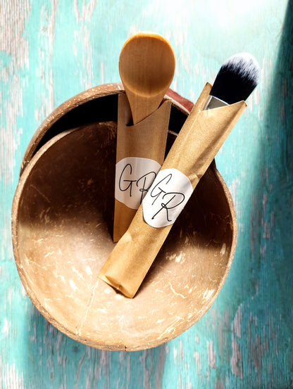 Gentle Roots Essentials Masking Kit displayed on rustic teal wood background.