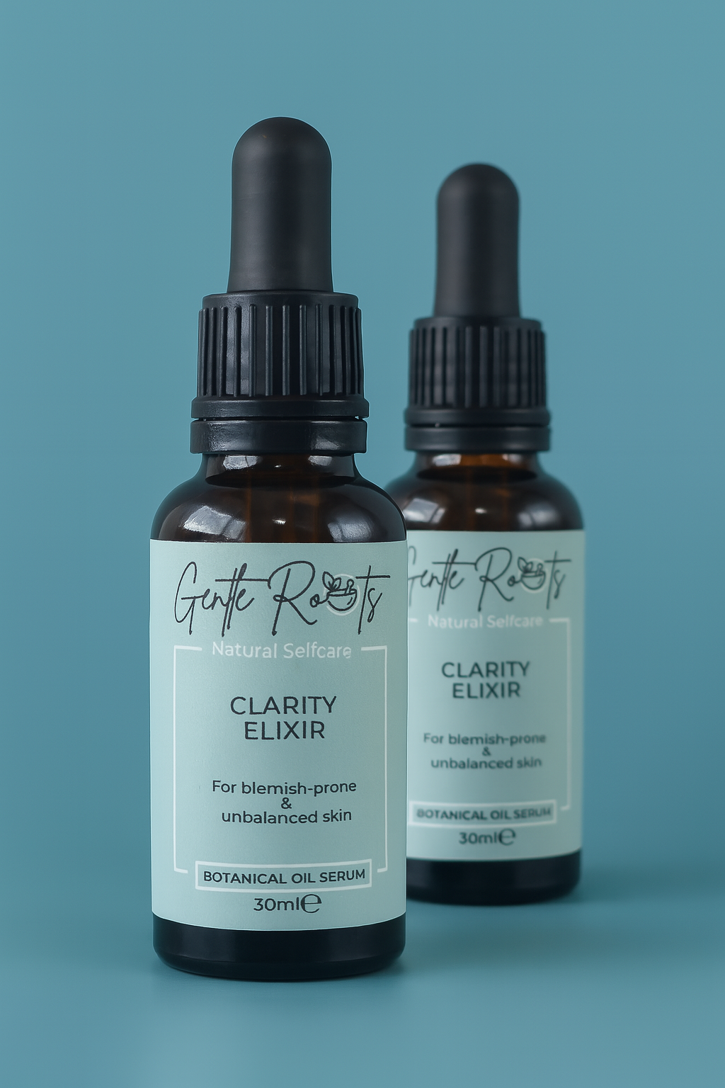 Gentle Roots Clarity Elixir – natural clarifying face oil serum for acne, unbalanced and blemish-prone skin, shown in two glass dropper bottles