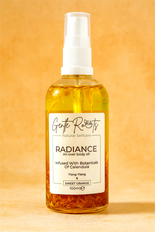 Gentle Roots Radiance Body Oil – natural glow boosting oil with sweet orange and ylang ylang in glass bottle.