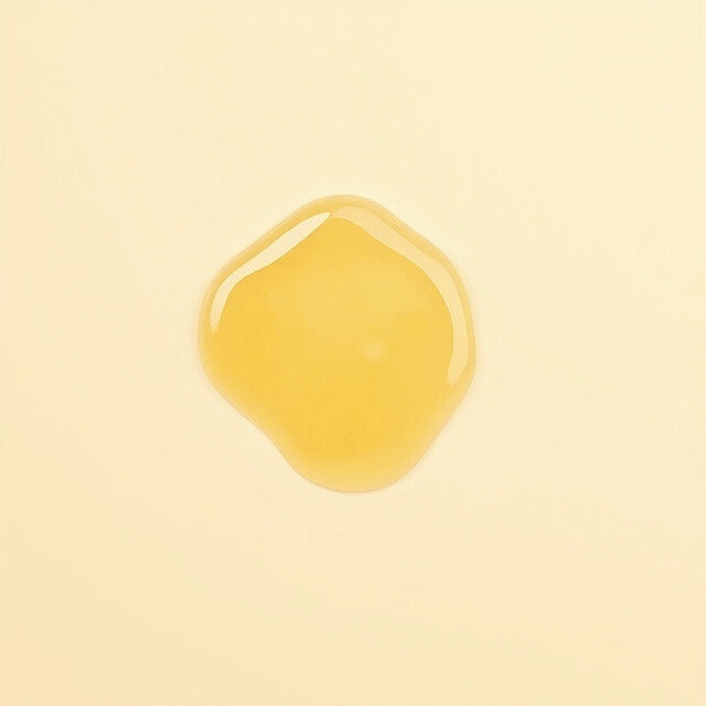 Texture shot of Gentle Roots Radiance Body Oil – golden botanical oil infused with calendula, sweet orange and ylang ylang.