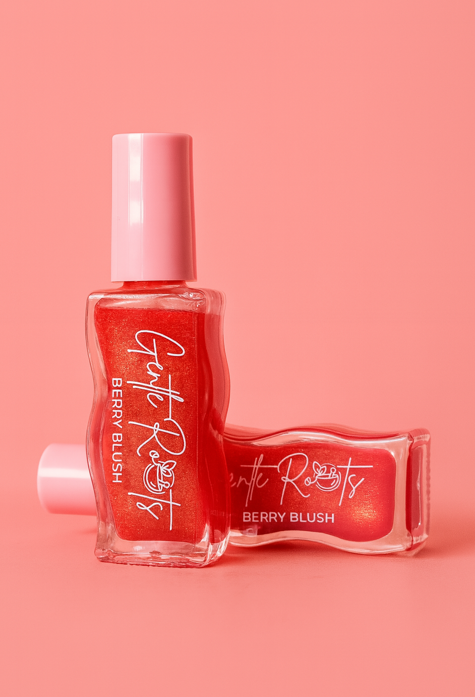 Gentle Roots Nourish Lip Oil Berry Blush, strawberry flavoured and tinted variant on bright pink background.