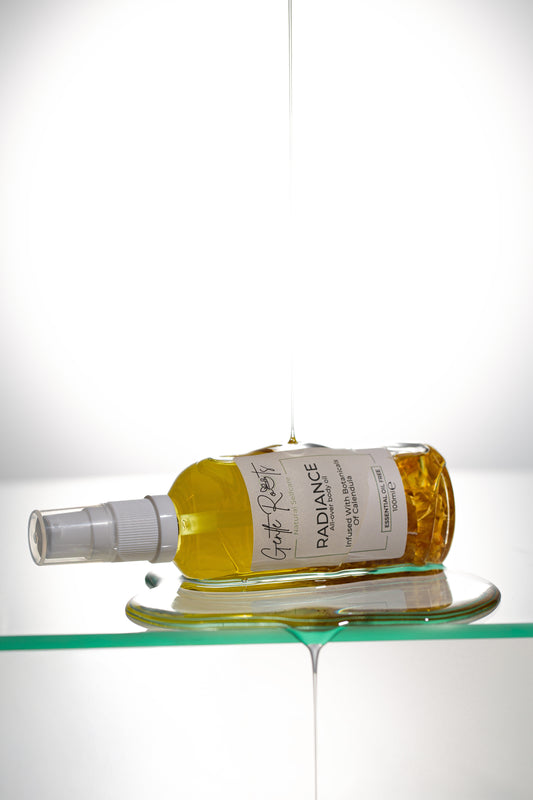 Gentle Roots Radiance Body Oil Unscented in glass bottle with botanical infusion texture shot