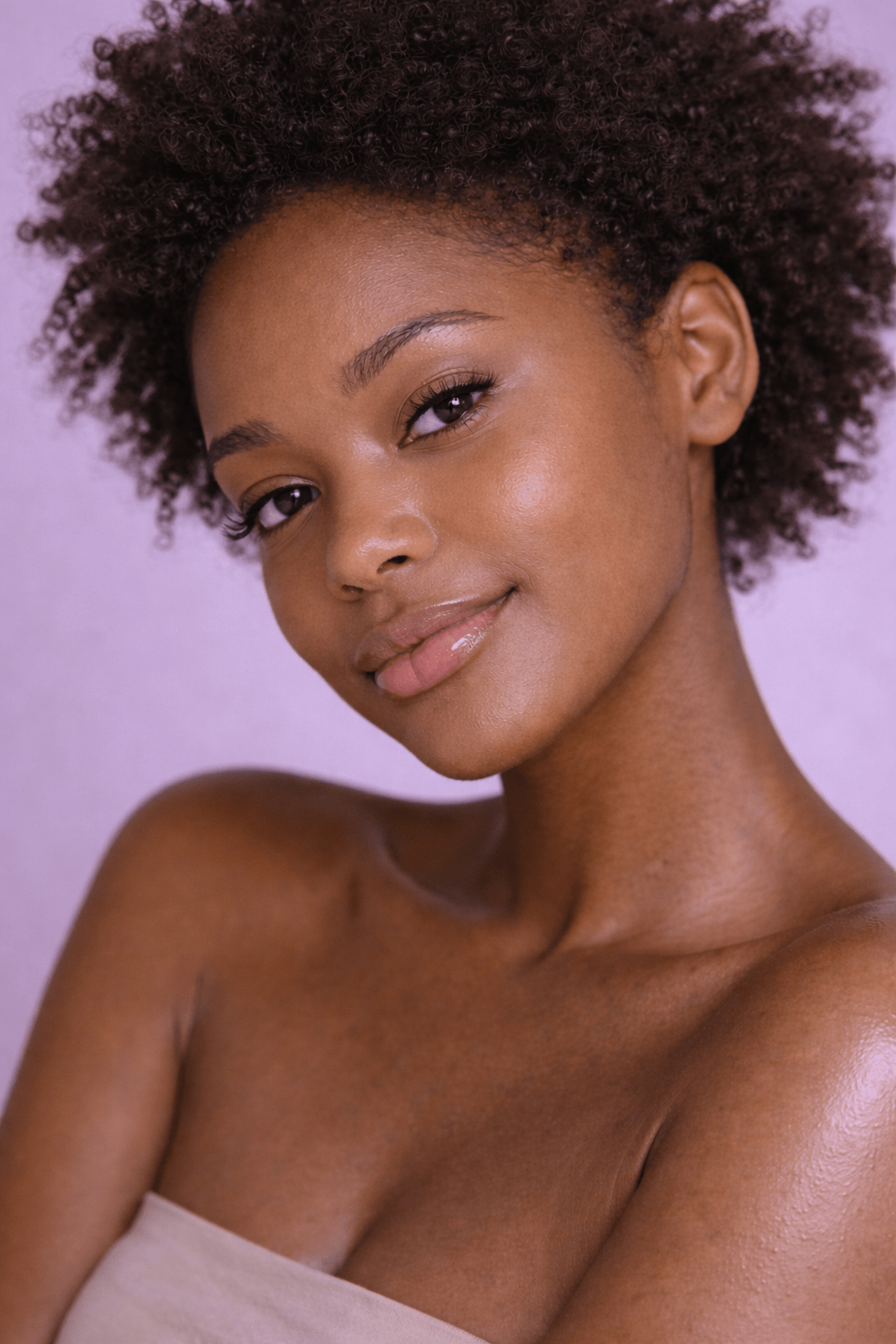 Close-up portrait of a Black woman with calm, nourished skin wearing minimal makeup, showcasing the soothing and barrier-restoring benefits of Gentle Roots Restore Elixir.