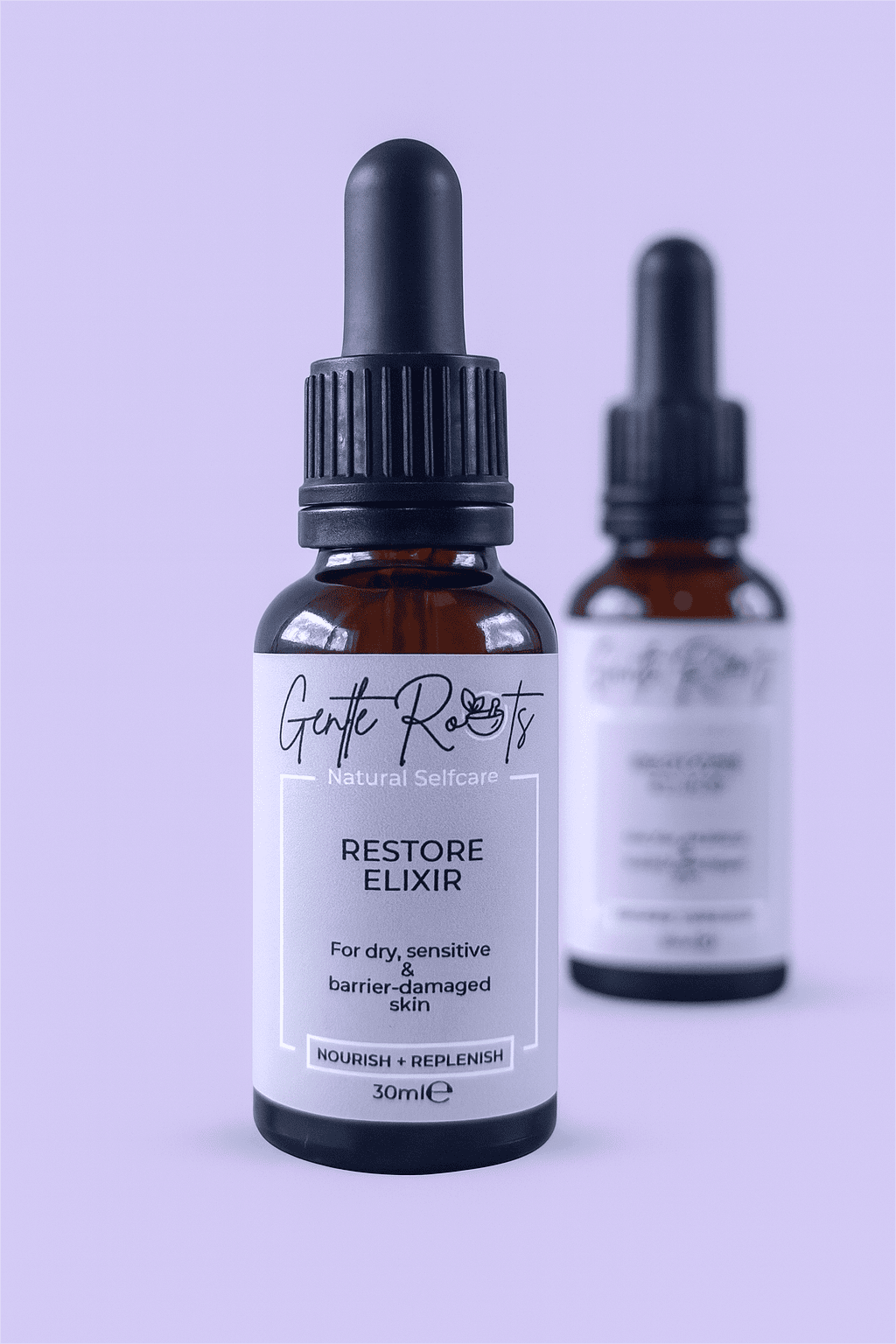 Pair of Gentle Roots Restore Elixir bottles – gentle, non-toxic skincare oil to strengthen and calm the skin barrier.